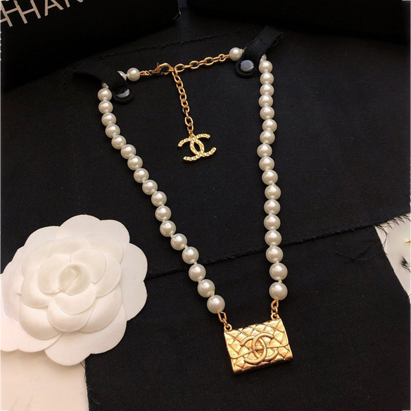 Chanel Pearl Bag Pendant 18K Gold Necklace
