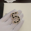 Chanel No.5 Leather Diamond 18K Gold Brooch