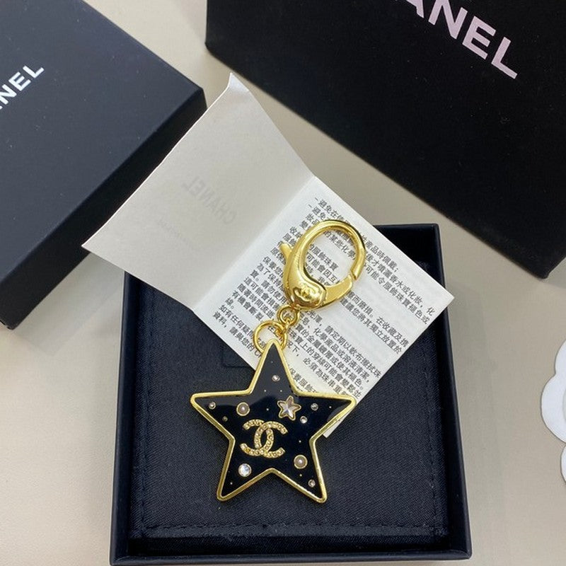 Chanel Black Gold Star 18K Gold Brooch