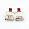 Chanel Red Bottle Pendant 18K Gold Earrings