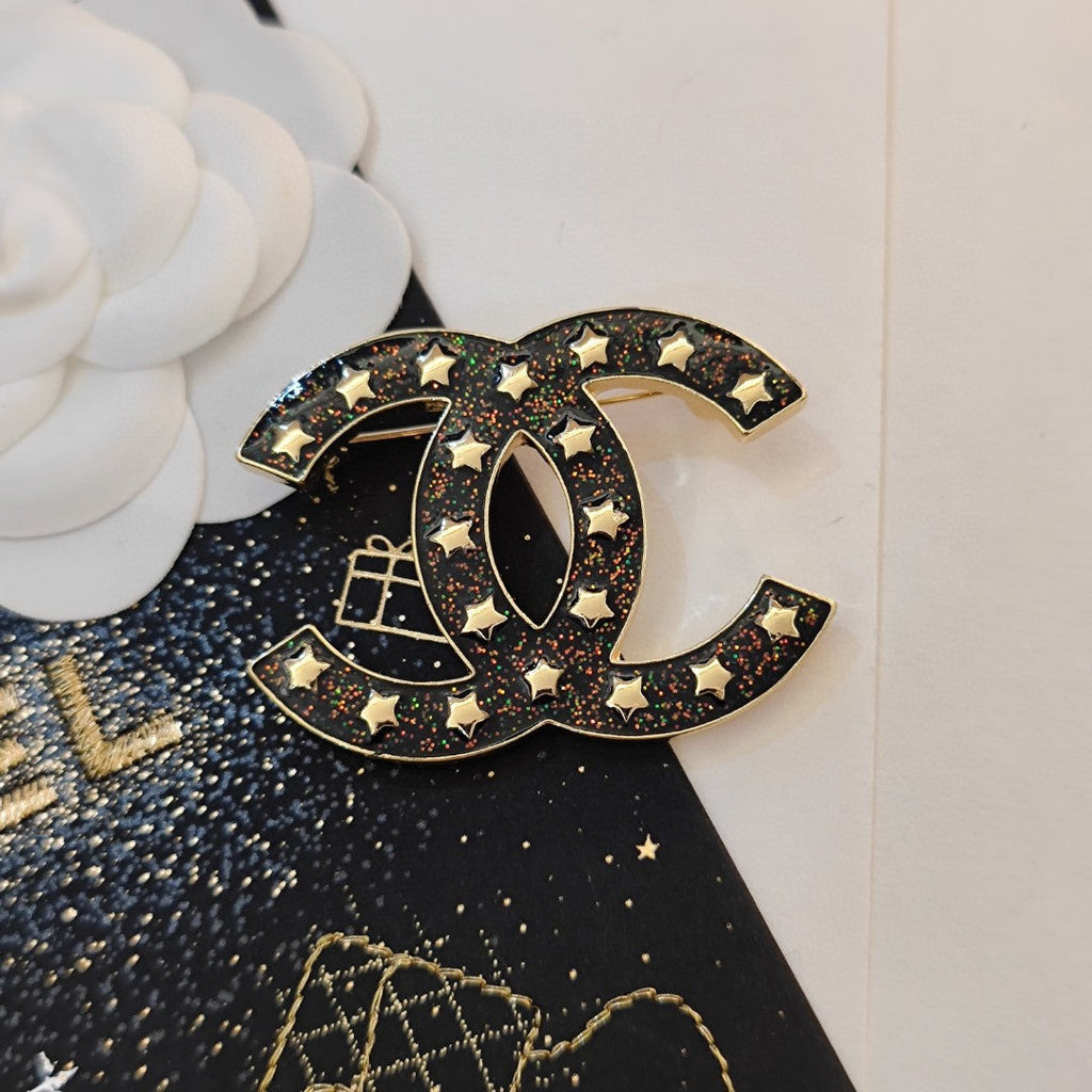 Chanel Black Star 18K Gold Brooch