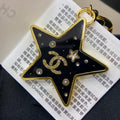 Chanel Black Gold Star 18K Gold Brooch