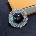 Louis Vuitton Black Ball 18K Gold Brooch