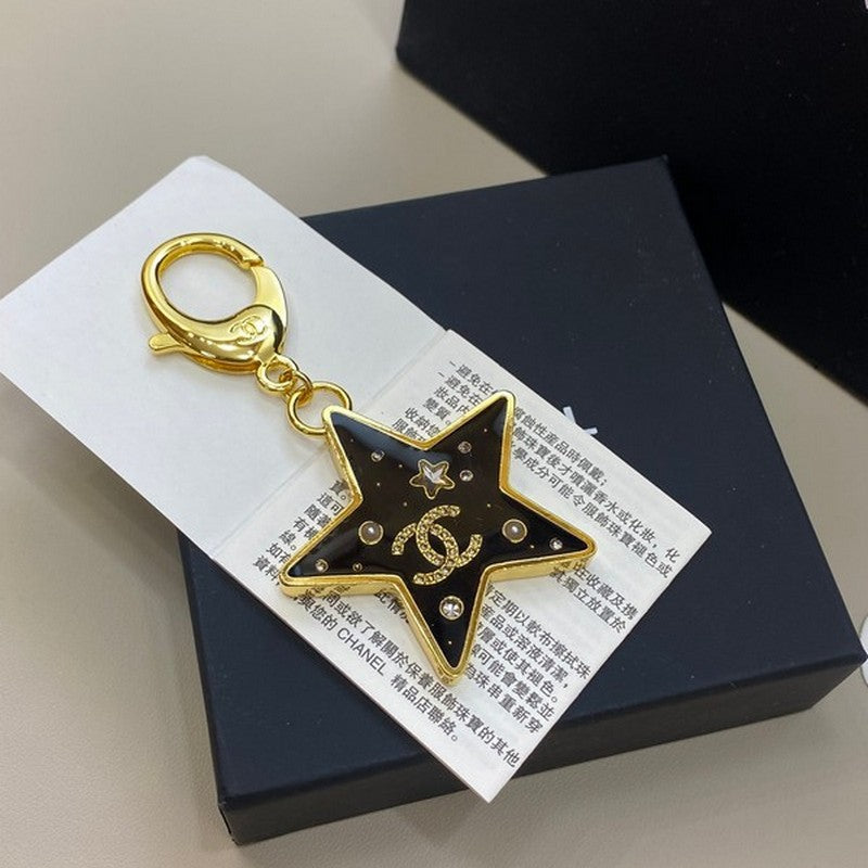 Chanel Black Gold Star 18K Gold Brooch