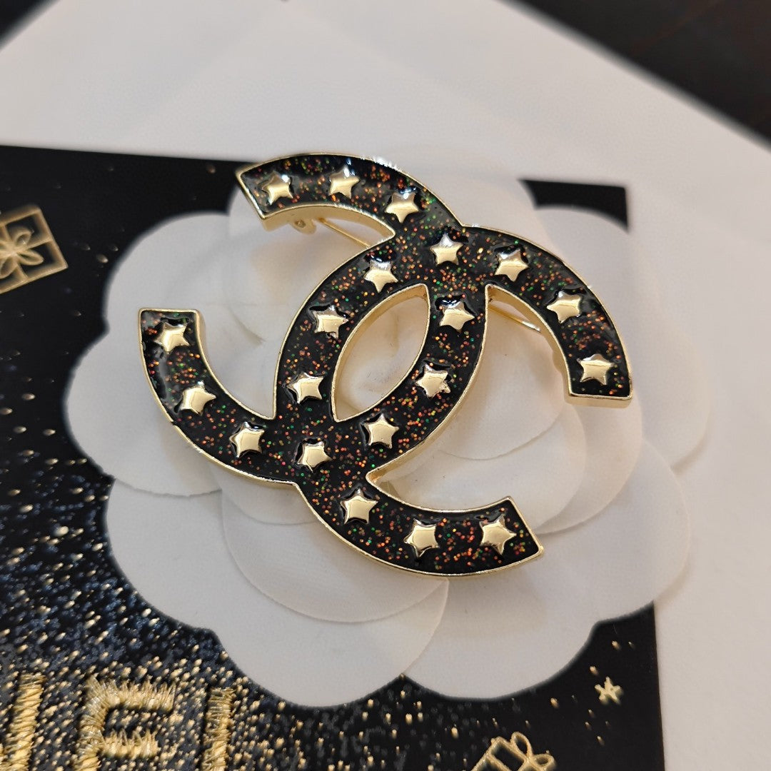 Chanel Black Star 18K Gold Brooch