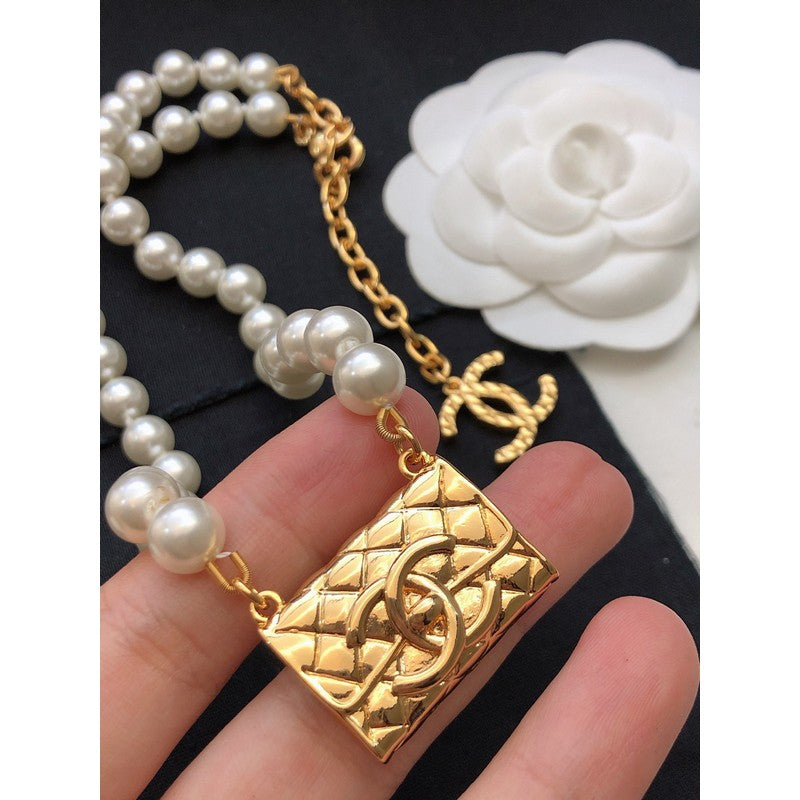 Chanel Pearl Bag Pendant 18K Gold Necklace