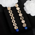 Chanel Script Pendant 18K Gold Earrings