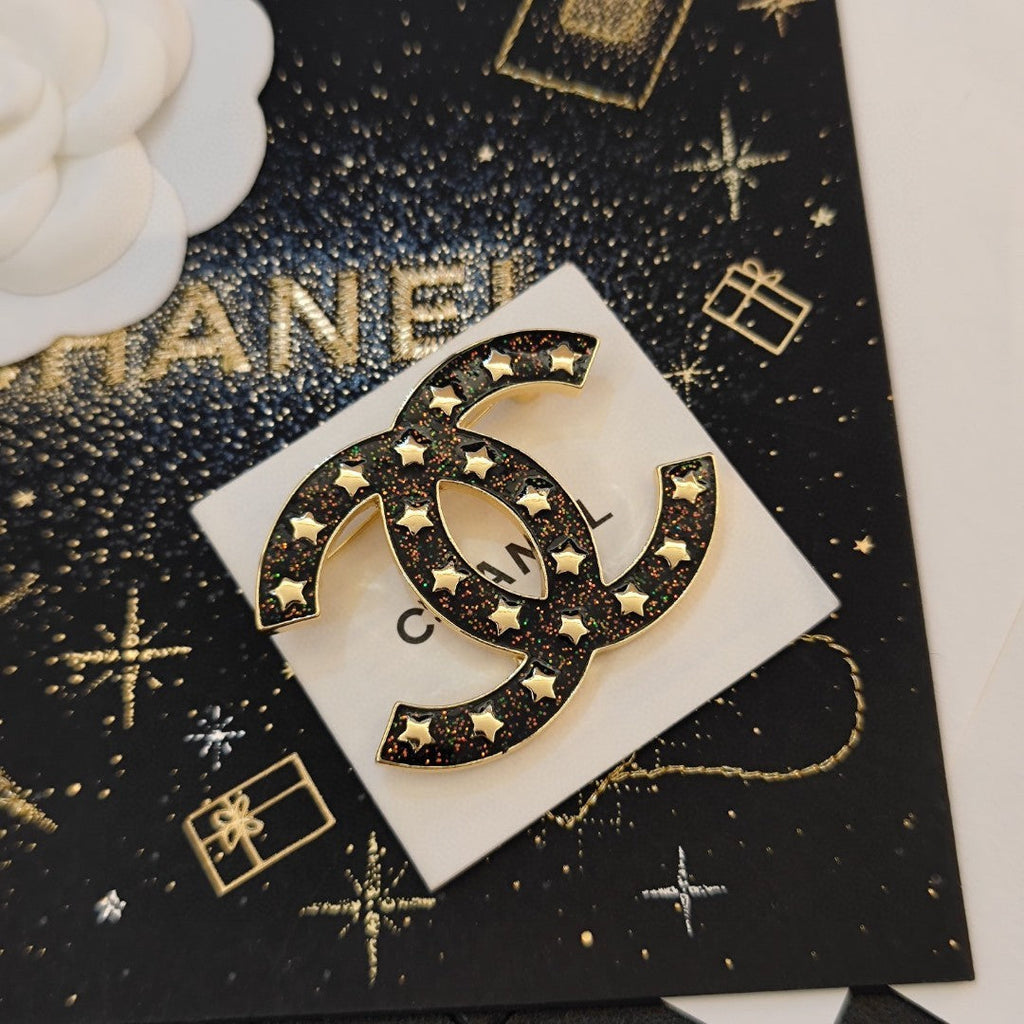 Chanel Black Star 18K Gold Brooch