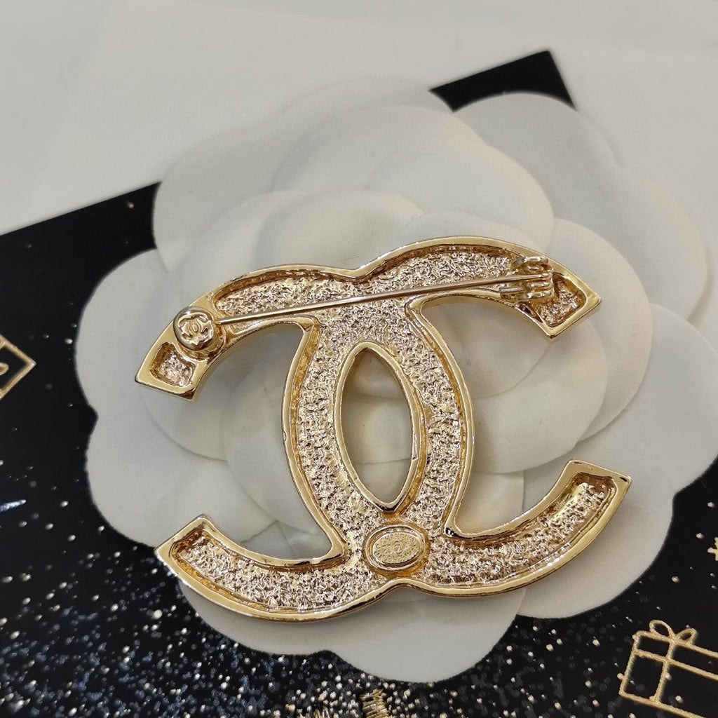 Chanel Black Star 18K Gold Brooch