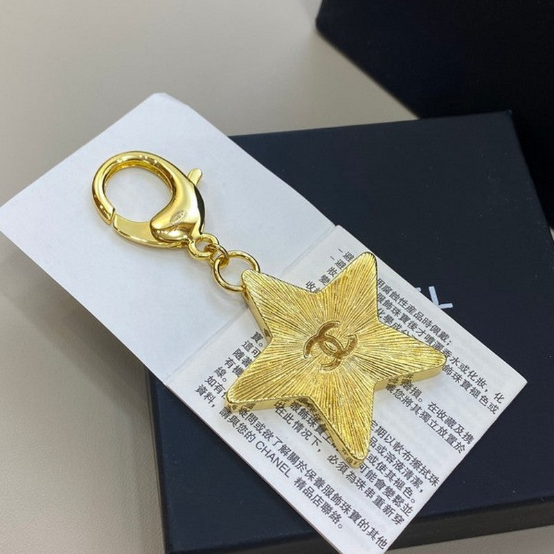 Chanel Black Gold Star 18K Gold Brooch
