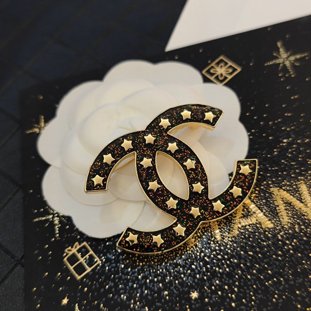 Chanel Black Star 18K Gold Brooch