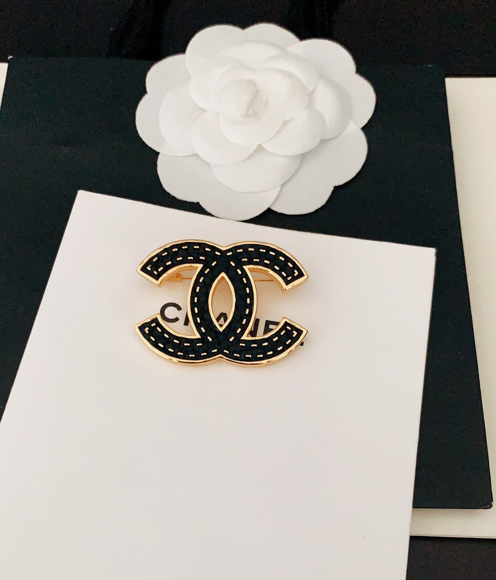 Chanel Black 18K Gold Brooch