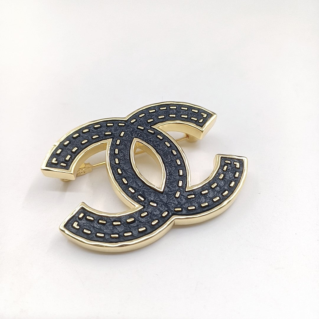 Chanel Black 18K Gold Brooch