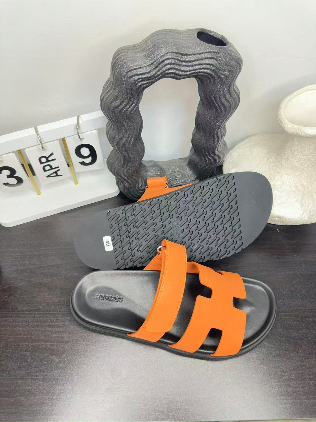 Hermès Orange Interwoven Slide Sandals — side