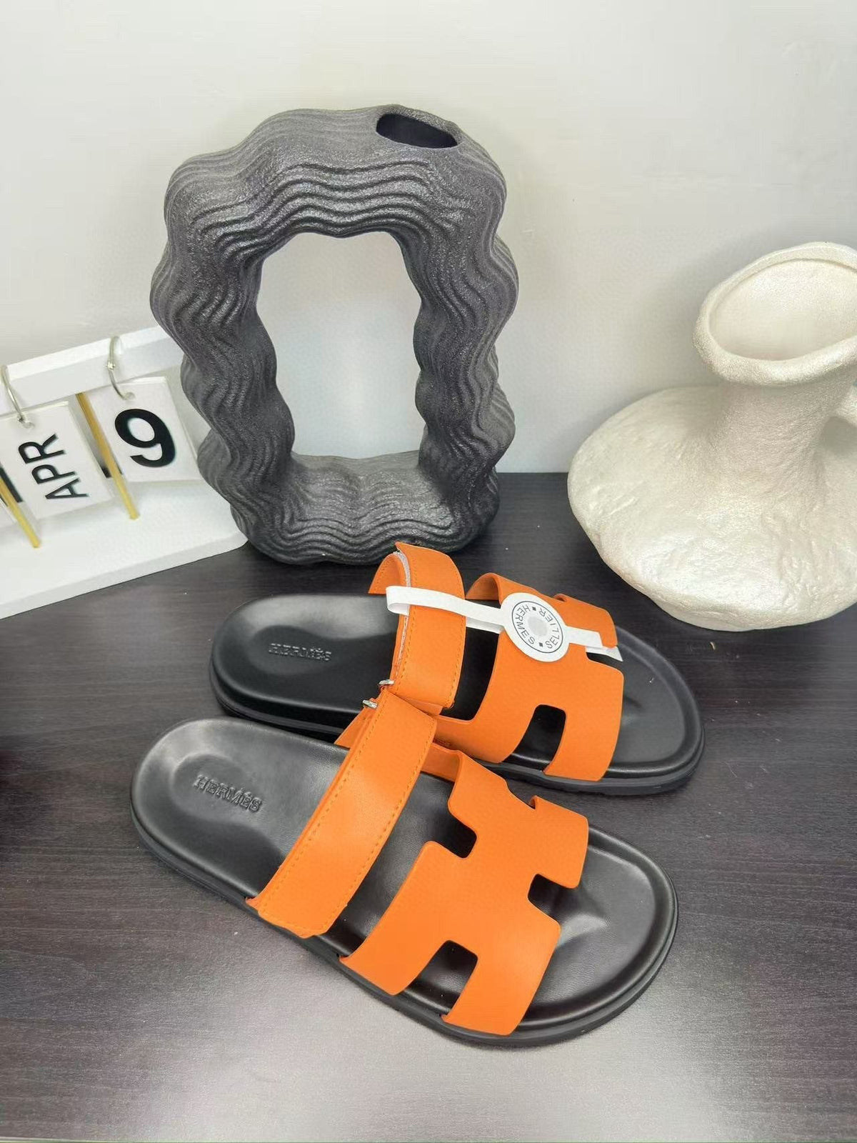 Hermès Orange Interwoven Slide Sandals — front