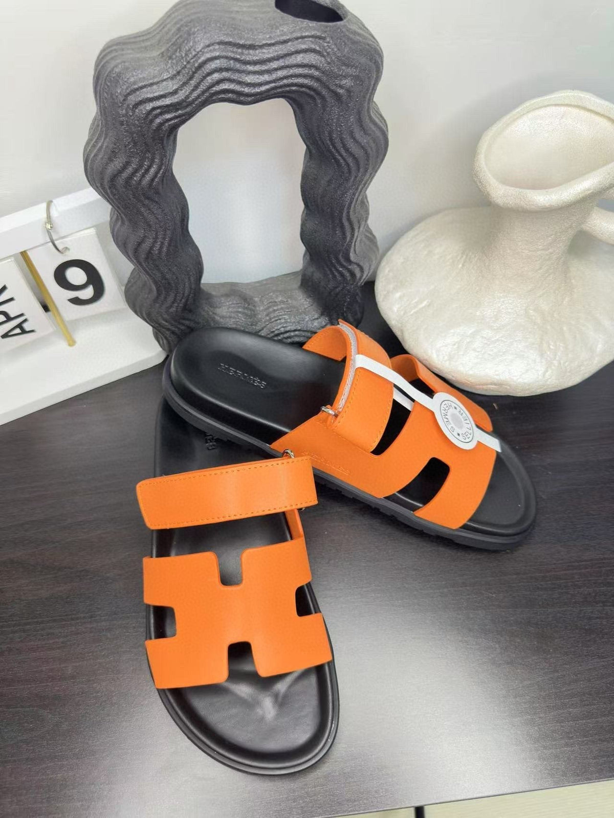Hermès Orange Interwoven Slide Sandals — front