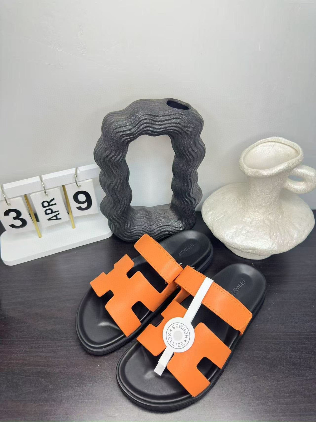 Hermès Orange Interwoven Slide Sandals — front