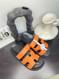 Hermès Orange Interwoven Slide Sandals — hero