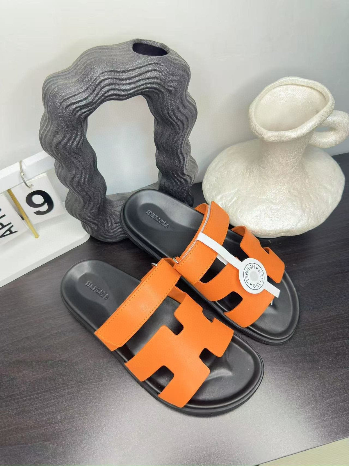 Hermès Orange Interwoven Slide Sandals — hero