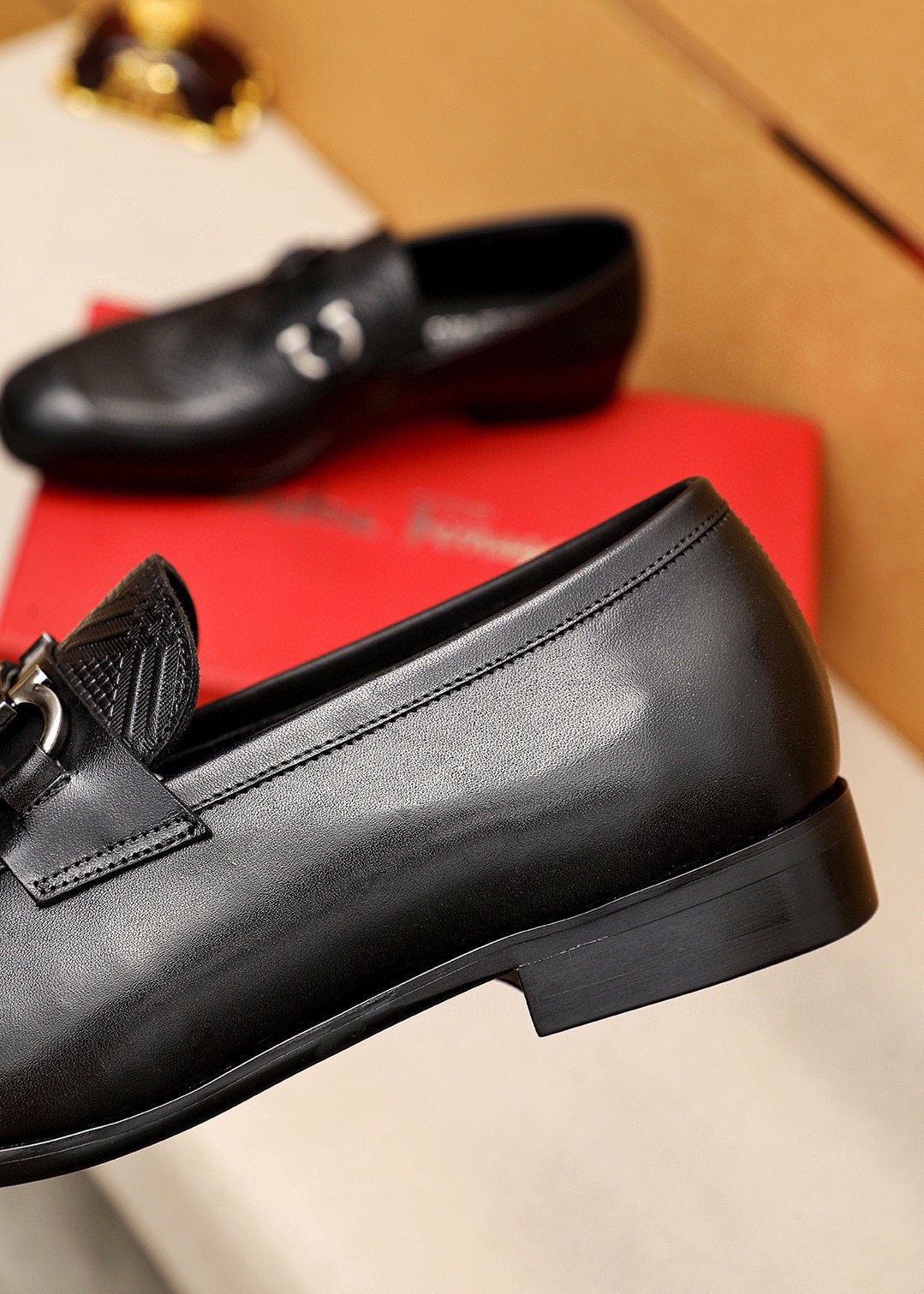 Ferragamo Black Embossed Buckle Loafers — model