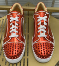Christian Louboutin Metallic Red Studded Sneakers — hero