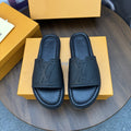 Black Embossed Slide Sandals — hero