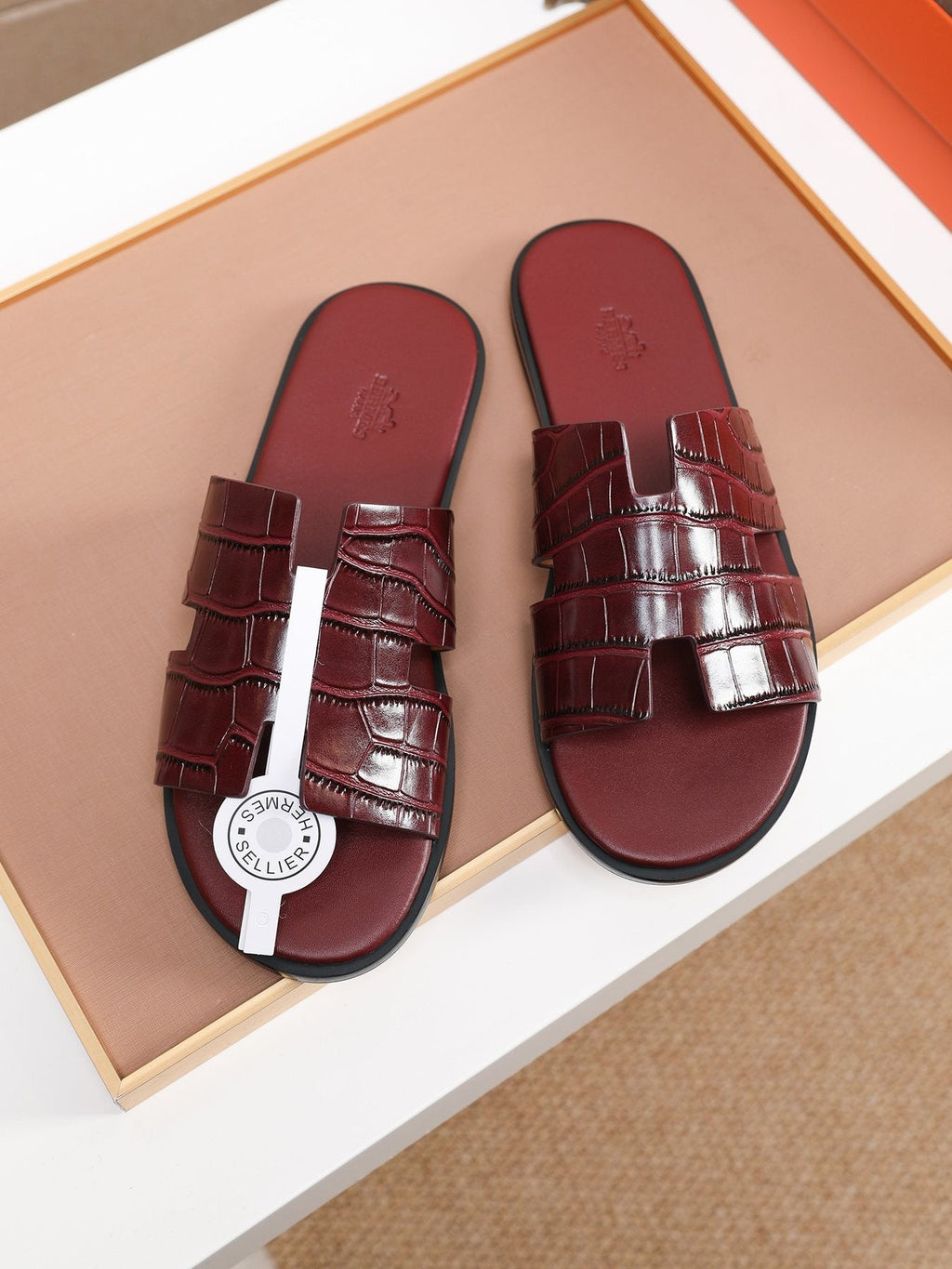 Hermès Burgundy Textured H Slide Sandals — front
