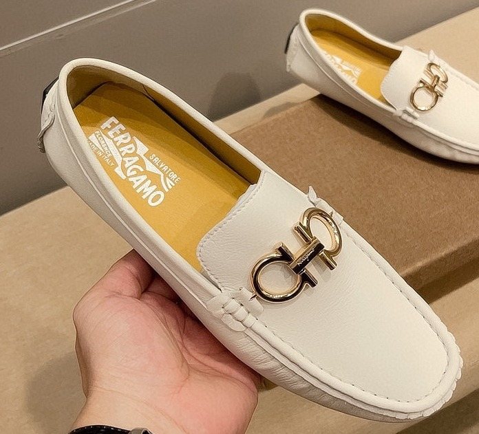 Ferragamo White Hardware Loafers — front