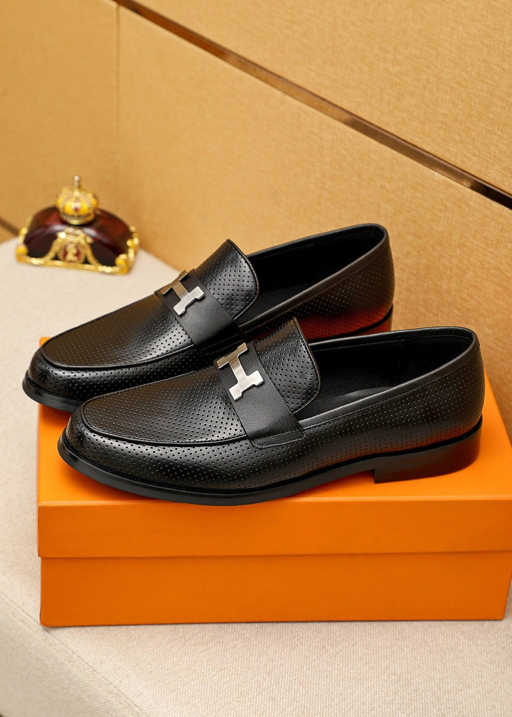 Hermès Black Perforated H-Hardware Loafers — front