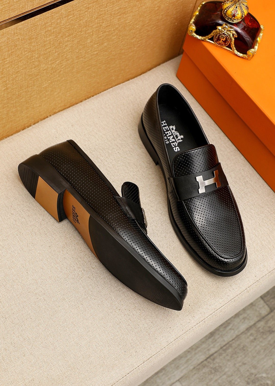 Hermès Black Perforated H-Hardware Loafers — front