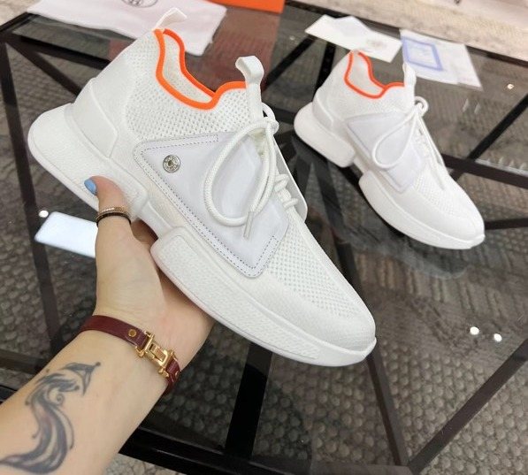 Hermès White Orange Knit Sneakers — front