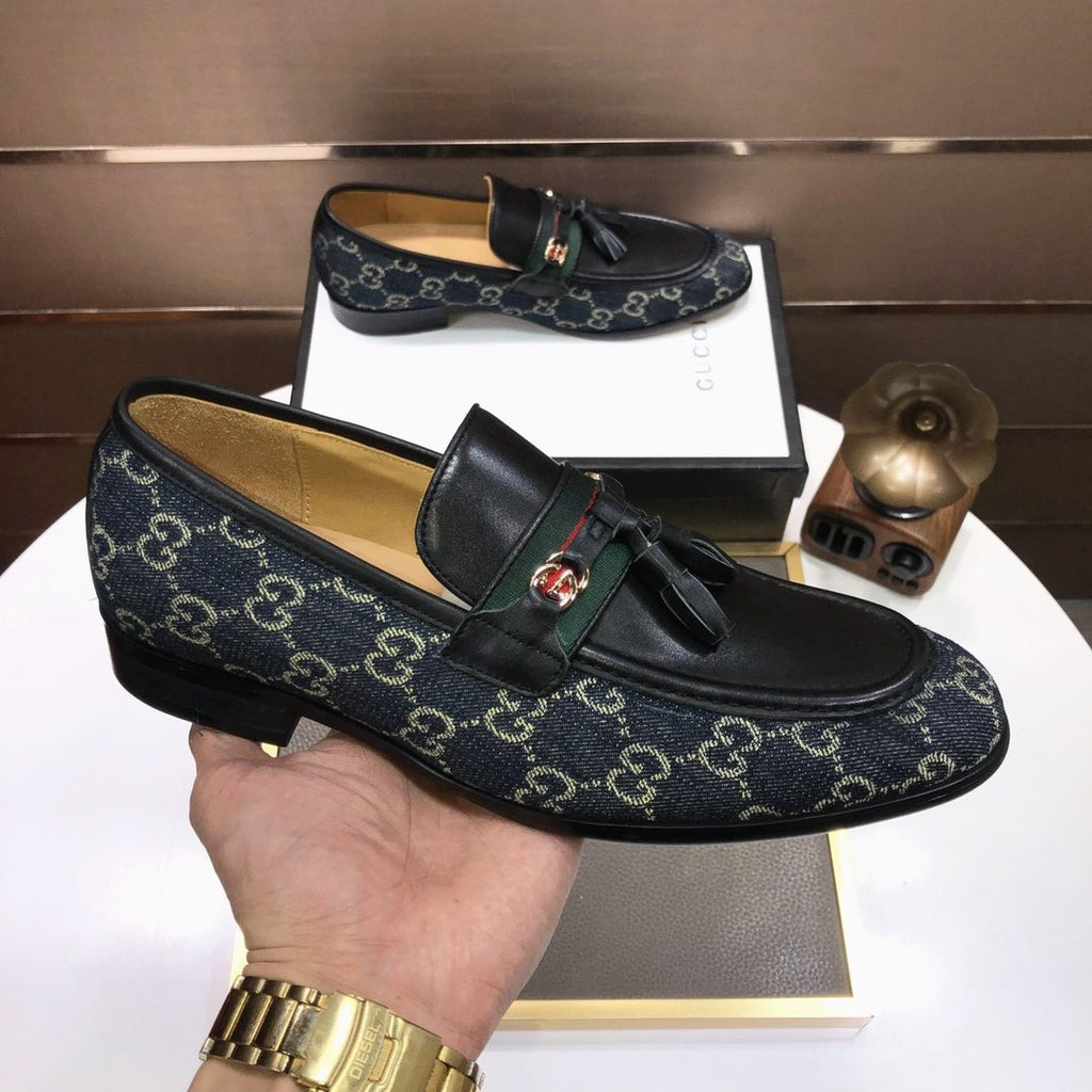 Gucci Monogram Tassel Loafers — model