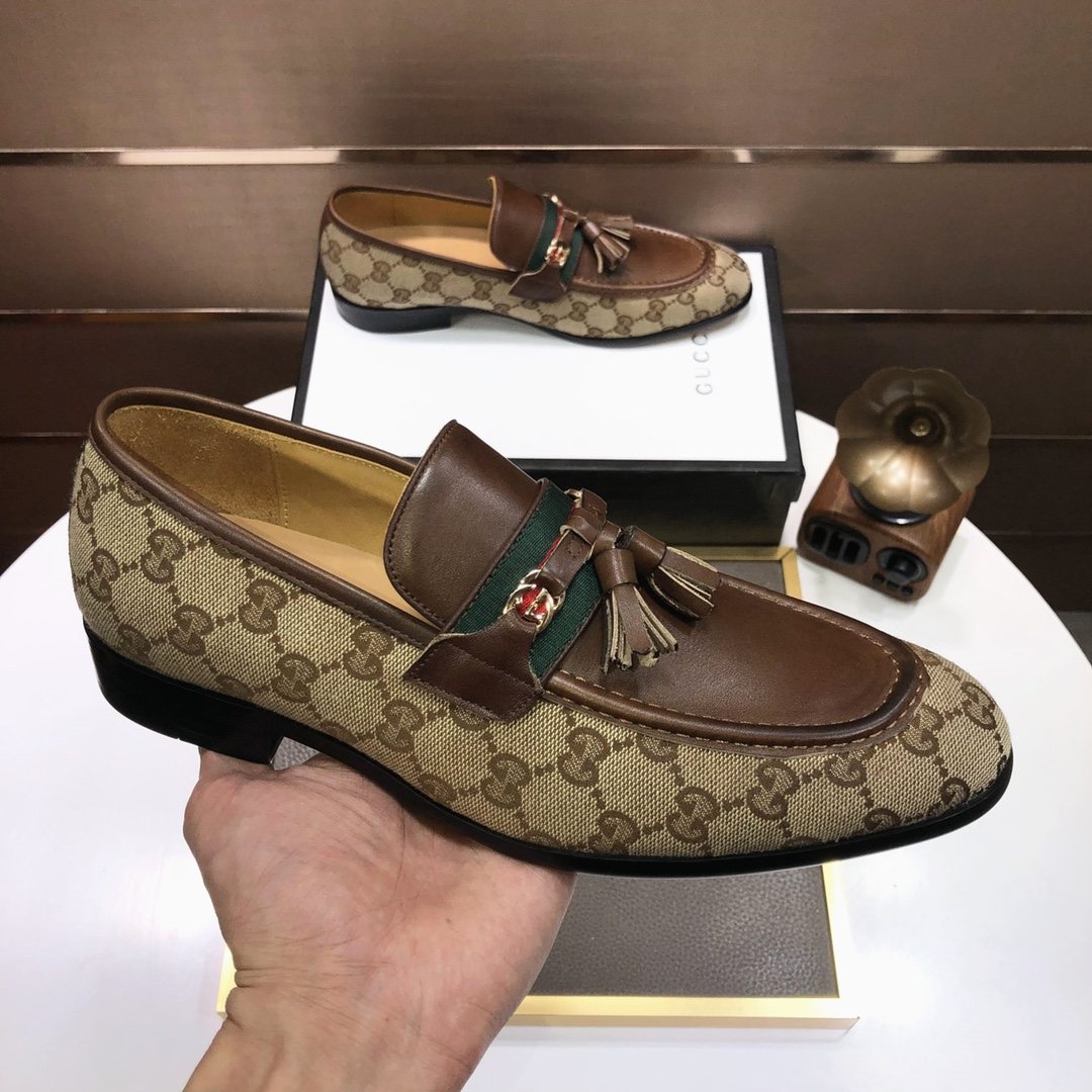 Gucci Monogram Tassel Loafers — model