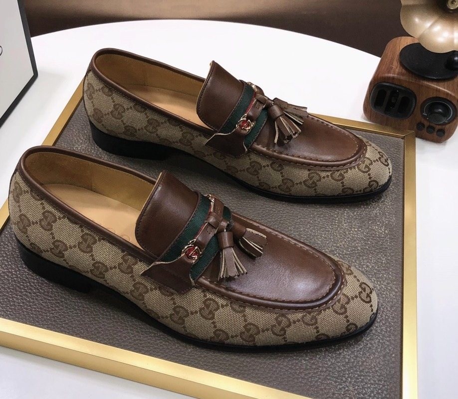 Gucci Monogram Tassel Loafers — hero