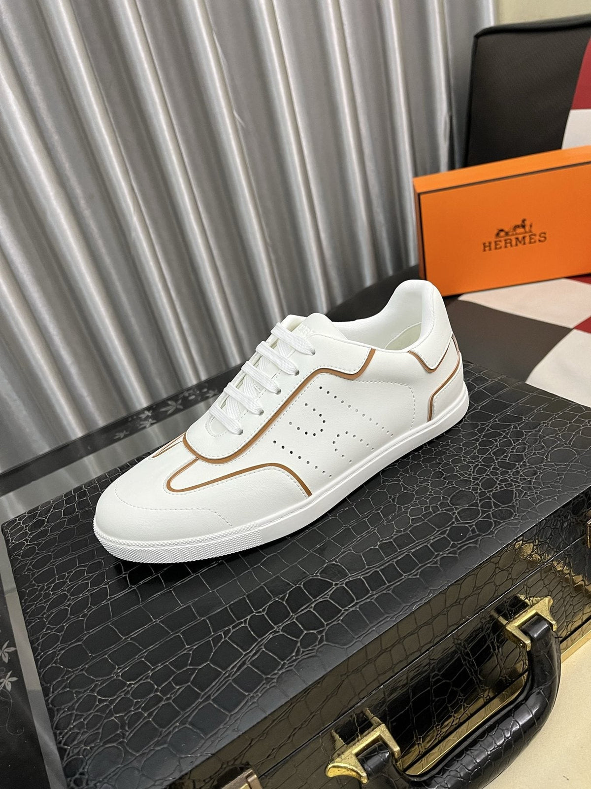 Hermès Perforated Low-Top Sneakers — front