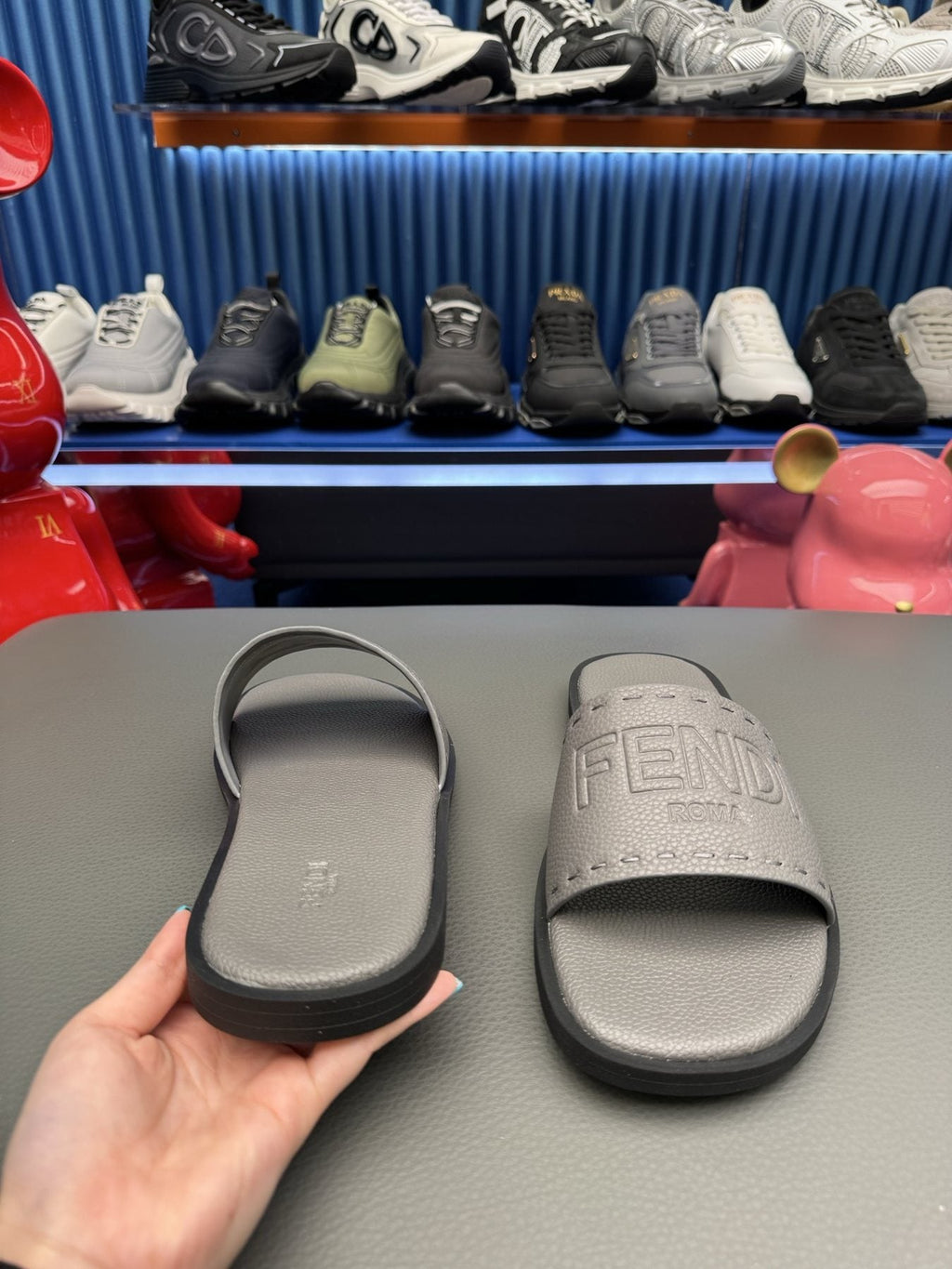 Fendi Embossed Logo Slide Sandals — side