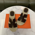 Hermès H-Cut Braided Footbed Slide Sandals — hero