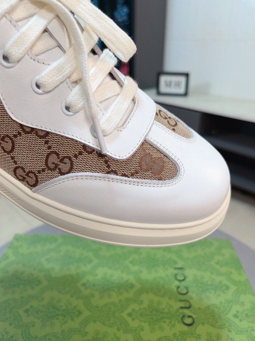 Gucci Embossed Low-Top Sneakers — detail