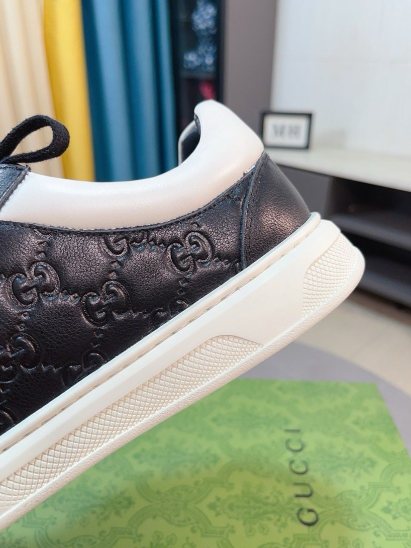 Gucci Embossed Low-Top Sneakers — detail