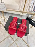 Chanel Embossed Logo Slide Sandals — hero