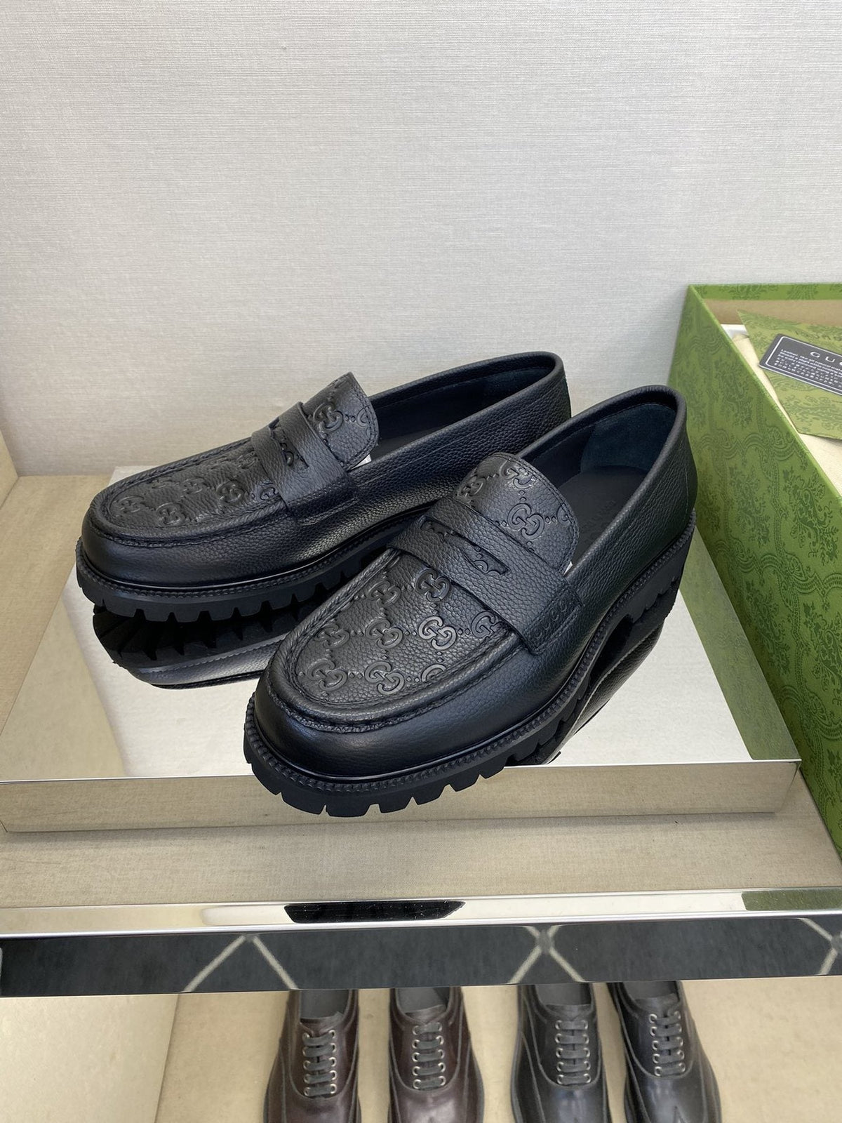 Gucci Black Embossed Lug Sole Loafers — front