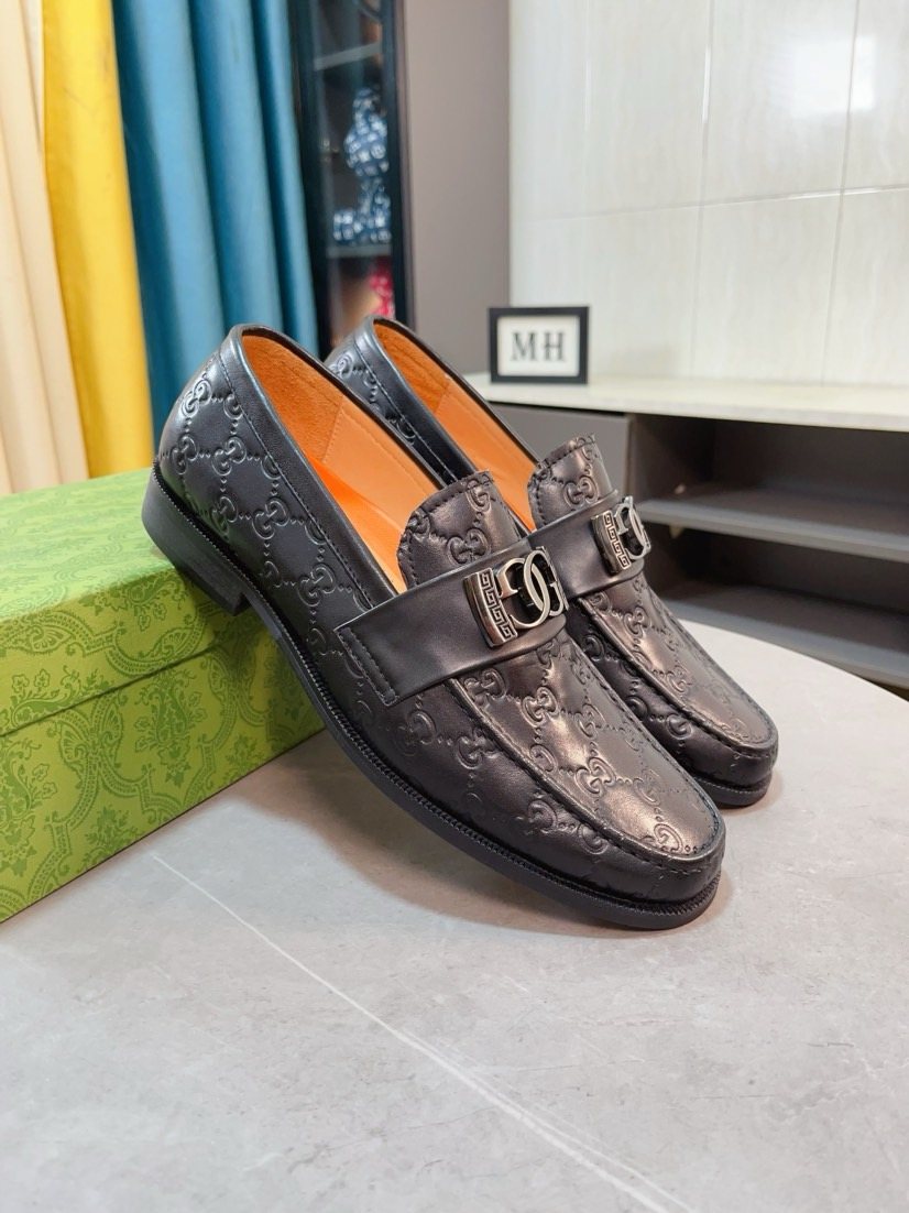 Gucci Embossed Metal-Hardware Loafers — front