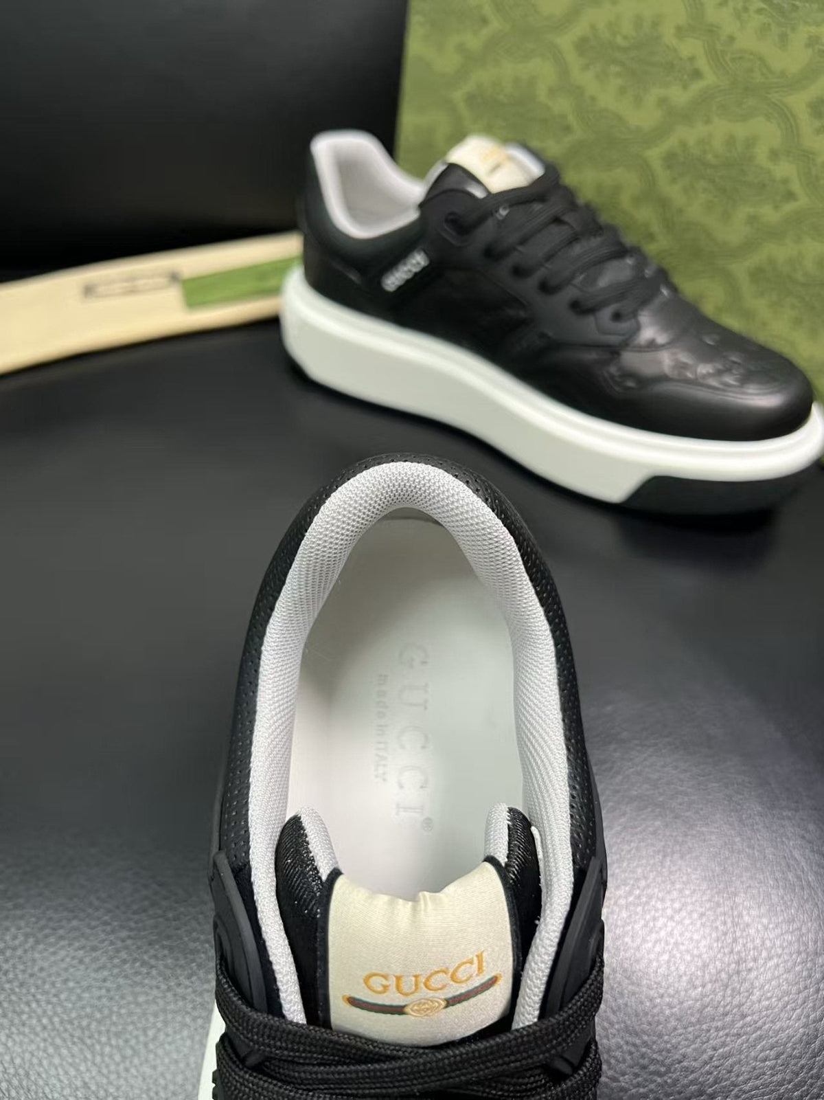Gucci Embossed Low-Top Sneakers — detail