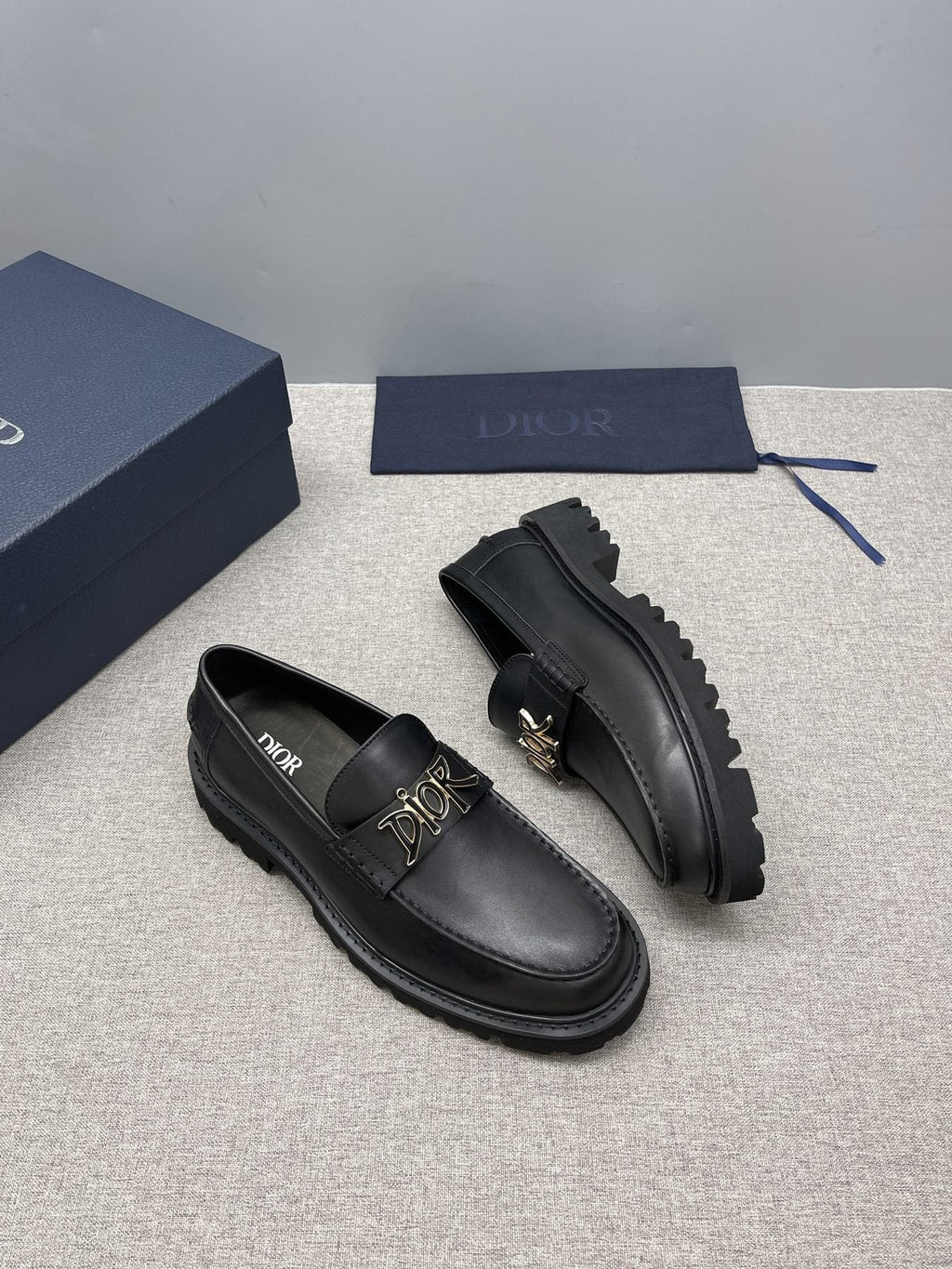 Dior Black Gold-Plaque Slip-On Shoes — side