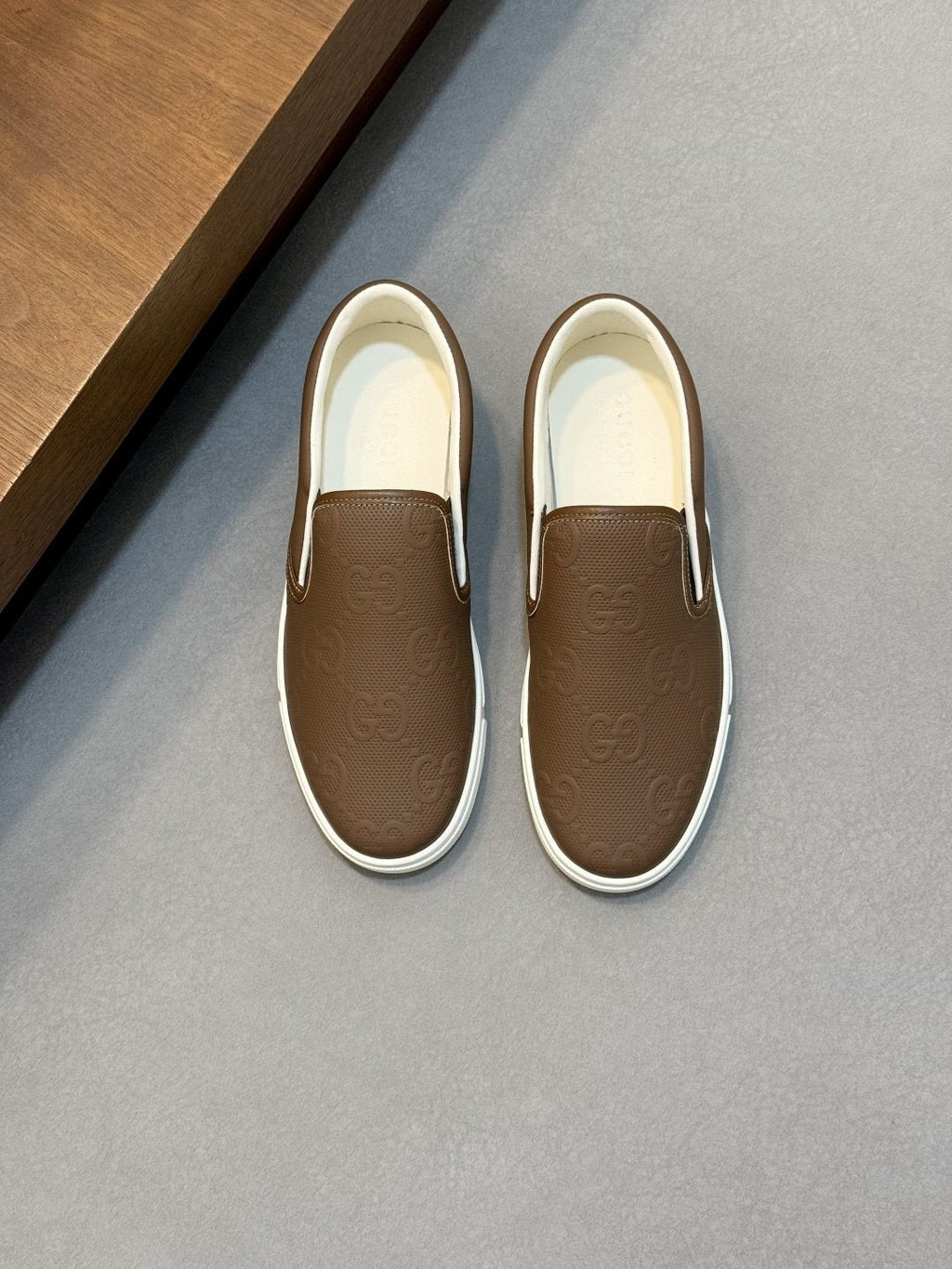 Gucci Embossed Slip-On Sneakers — front