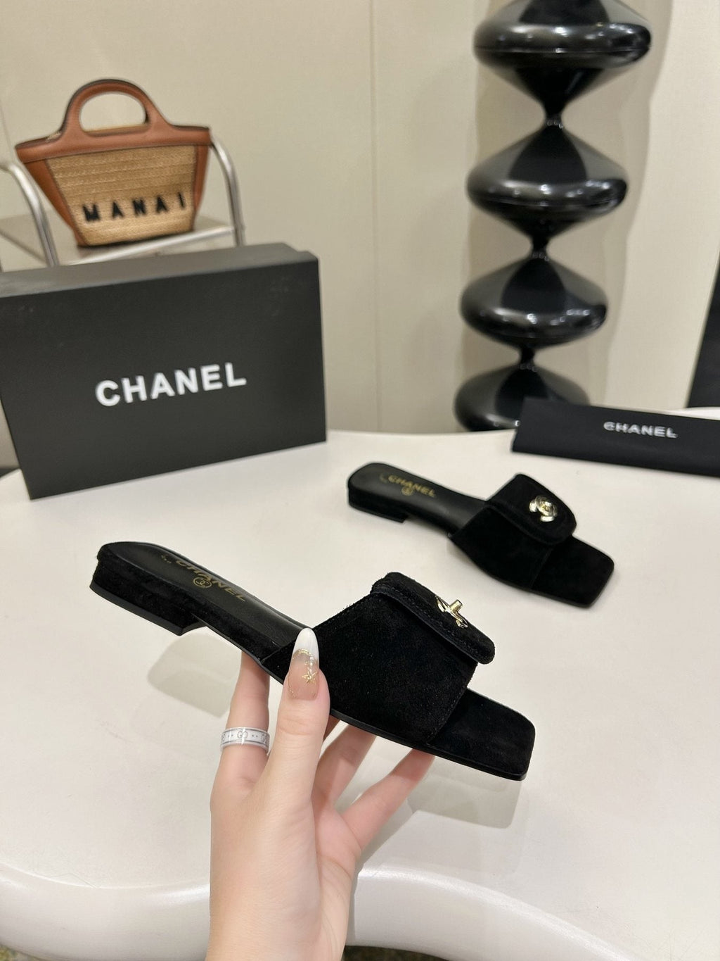 Chanel Square-Toe Emblem Slide Sandals — model